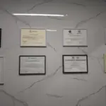 Professional certificates displayed at Saranda Dental Center