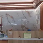 Reception desk and certificate wall at Saranda Dental Center