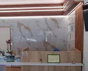 Reception desk and certificate wall at Saranda Dental Center